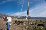 Volunteers installing Weather Station at Hydro Plant - 